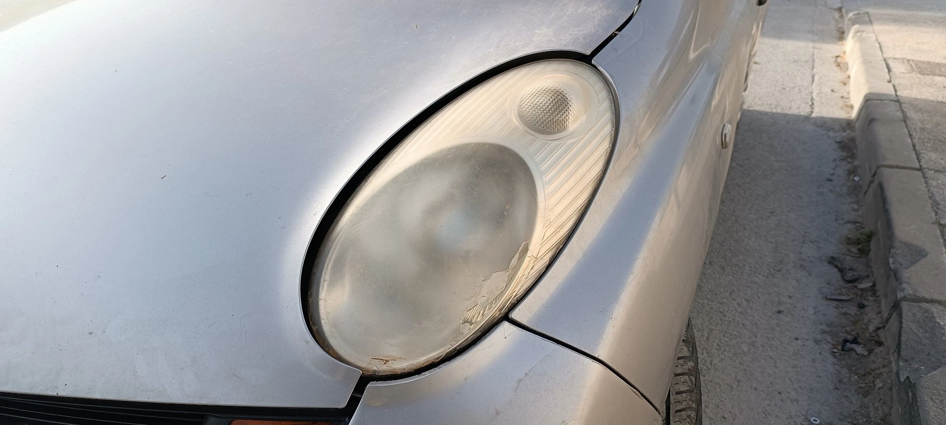 FAROL ESQUERDO NISSAN MICRA III